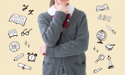 顎に手を当てて考える十代女性