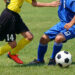 サッカーの試合をしている人達