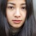 黒い長い髪の女性のキッとした表情のアップ